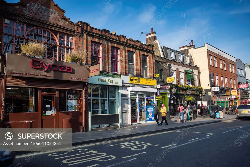 Row of shops and restaurants in Coldharbour Lane, Brixton, London, UK.