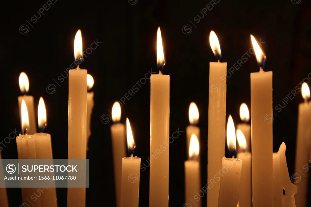 Many candles inside santa maria in trastevere church in Rome Italy