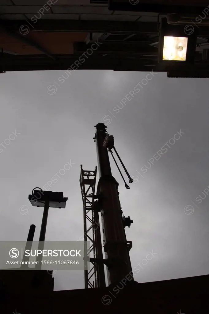 heavy duty crane on building construction site at night