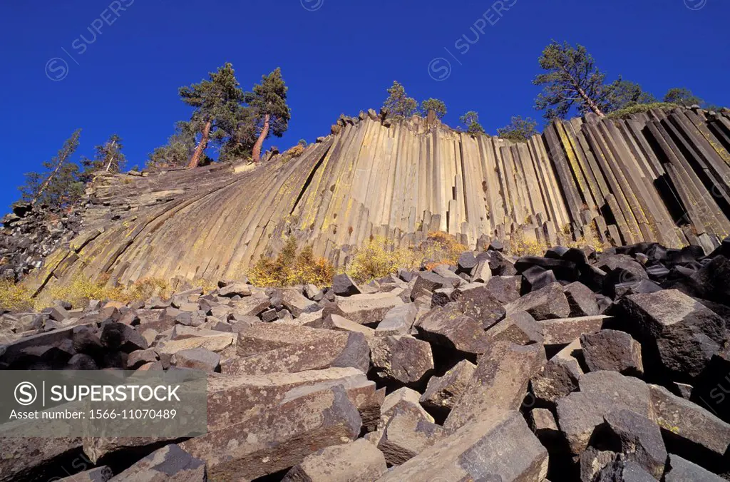 Cliff and blocks of columnar basalt at Devils Postpile, Devils Postpile National Monument, California USA.