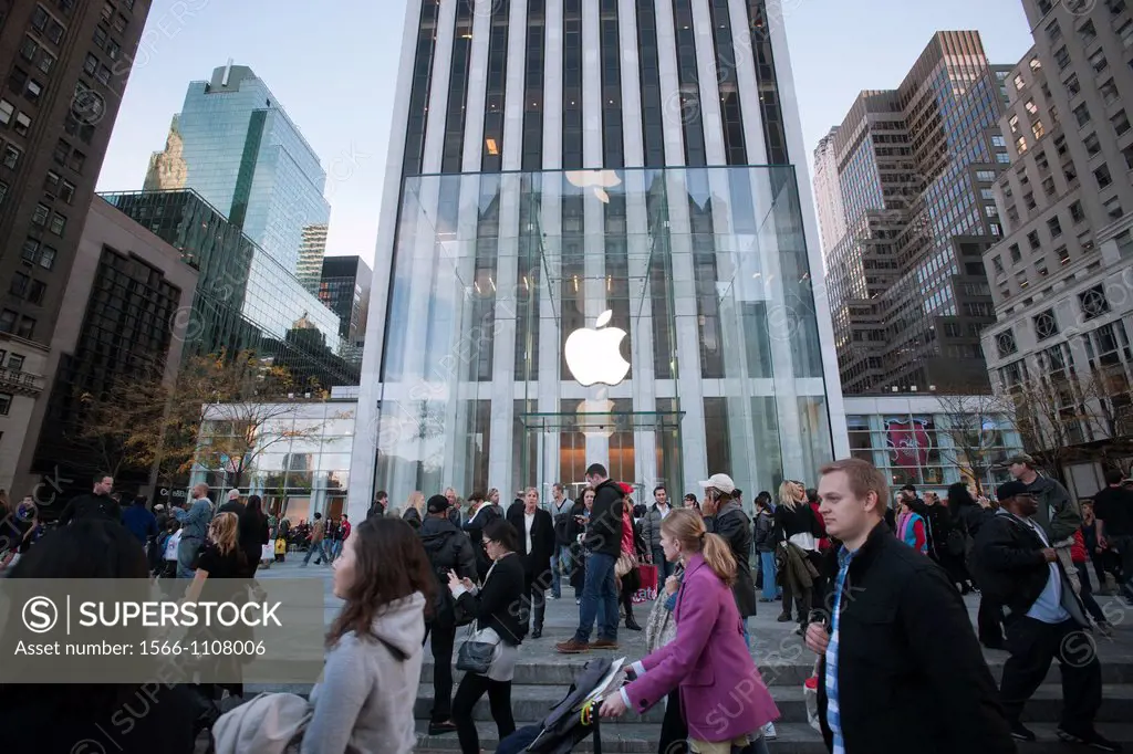 Shoppers looking for bargains on Black Friday, the day after Thanksgiving pass the glass cube at the entrance to the Apple store on Fifth Avenue in Ne...