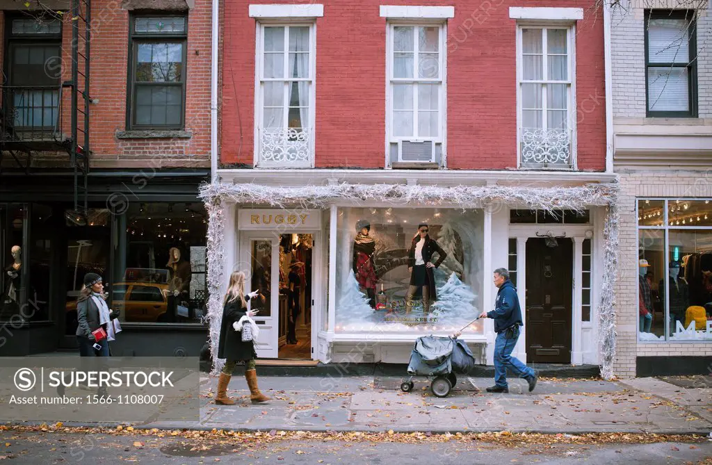 Upscale retail stores and businesses, including Rugby Ralph Lauren, on Bleecker Street in Greenwich Village in New York