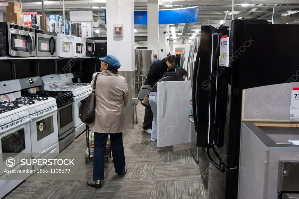 Shoppers browse appliances in a Best Buy in the Elmhurst neighborhood in the borough of Queens in New York over the Black Friday weekend Sales for Bla...