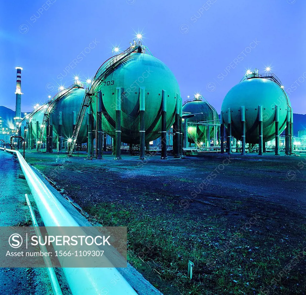 Night square image gas and oil industry. Finished goods tanks