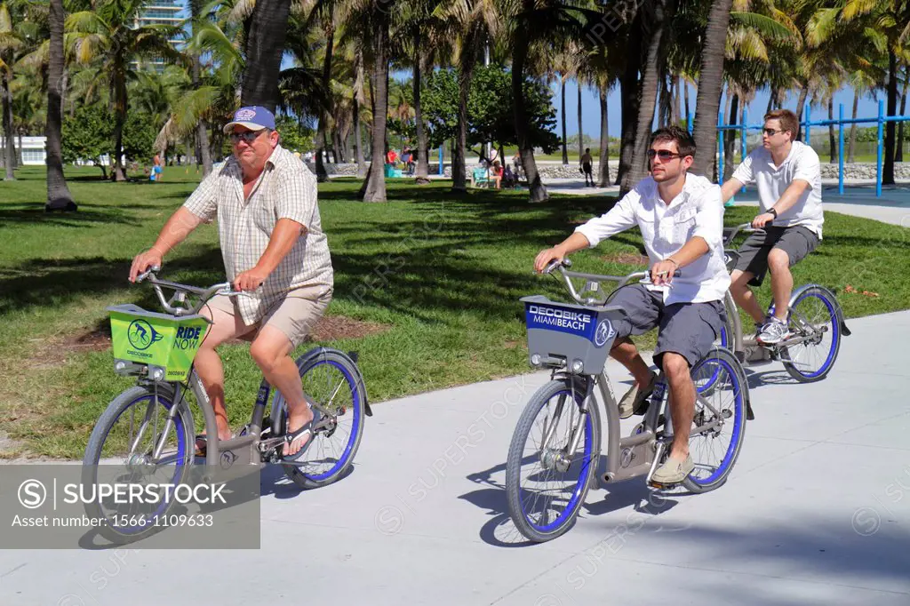Florida, Miami Beach, Lummus Park, Serpentine Trail, man, bicycles, rental, bike share, DecoBike,