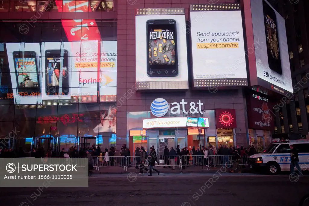 An AT&T cell phone store is surrounded by a massive electronic Sprint advertisement, seen in Times Square in New York