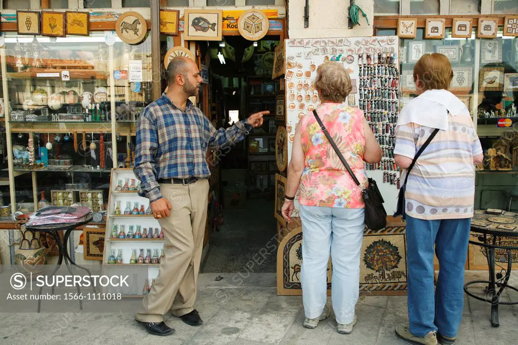 Tourists at a souvenir shop in Madaba, Jordan