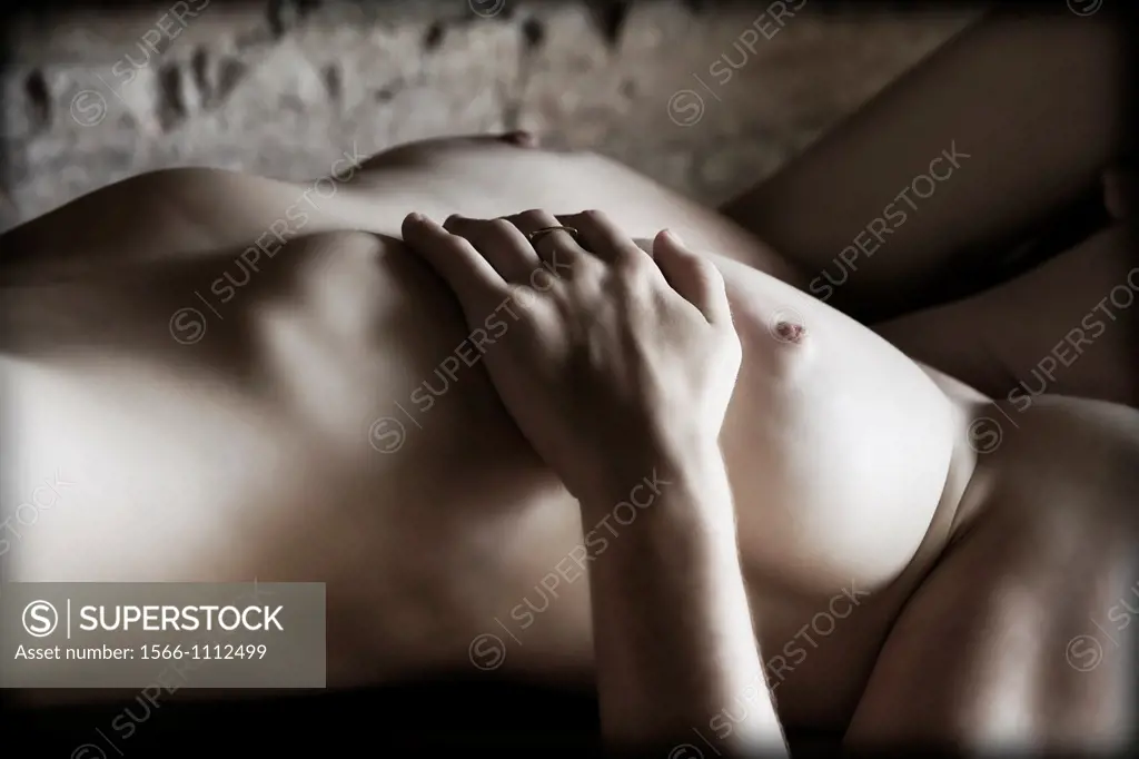 Close-up of a topless model in studio.
