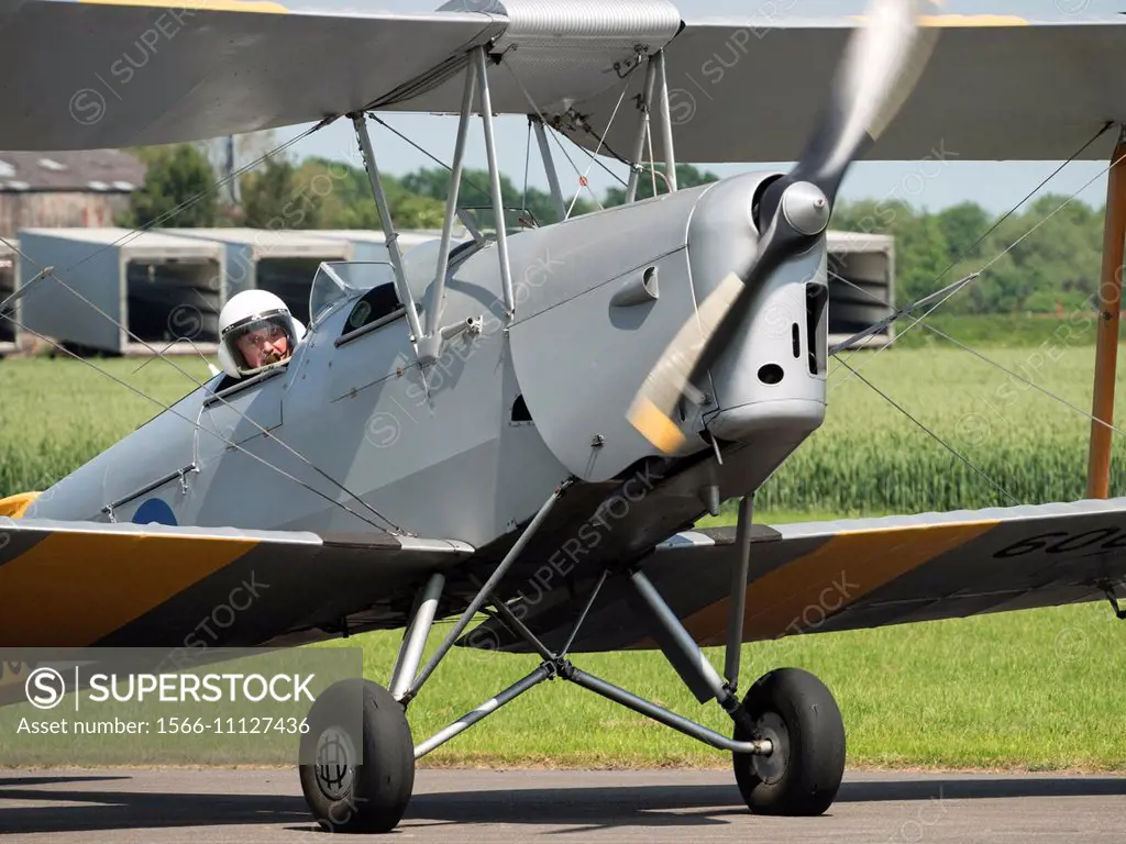 A 1930s era Tiger Moth biplane, a classic civil aircraft at Breighton general aviation airfield,near Selby, Yorkshire,UK.