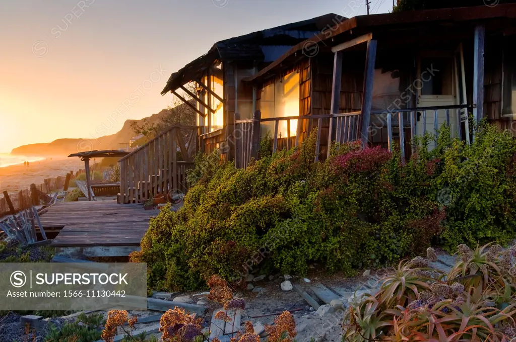 Sunset and old beach bungalow cabins at Crystal Cove State Park Historic District, Corona del Mar, Newport Beach, California.