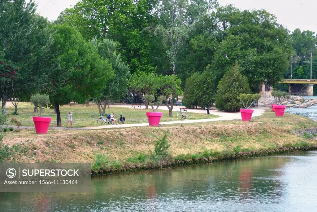 The municipal park in Agde France is an island bordered by the HERault River and the Canal du Midi.
