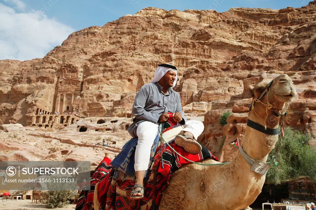 Beduin sitting on a camel, Petra, Jordan