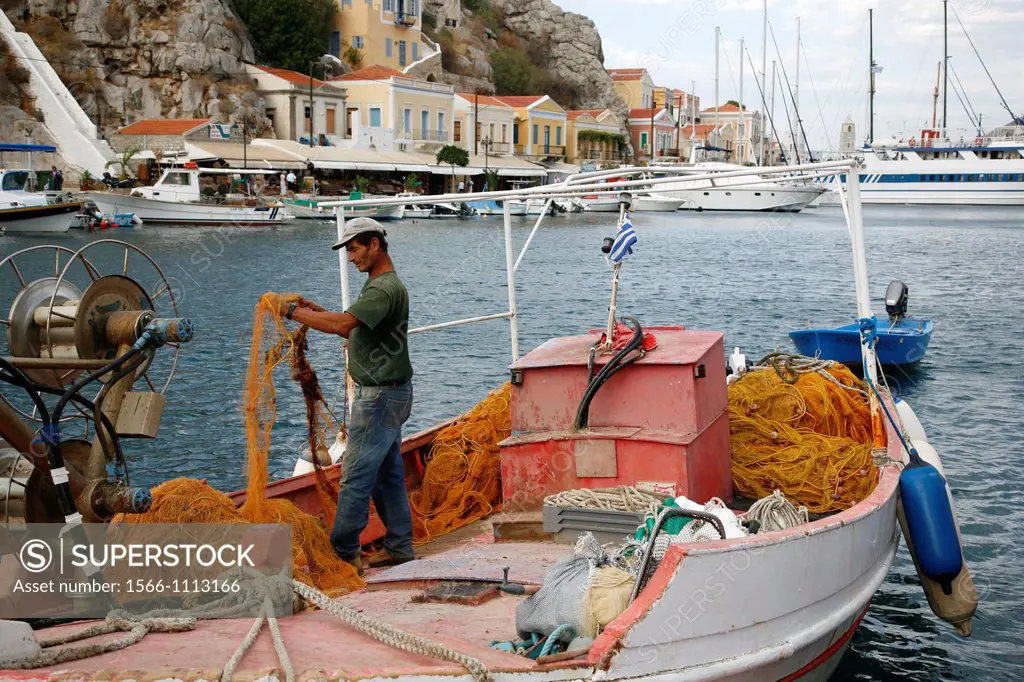 Fisherman at the harbour, Symi, Greece