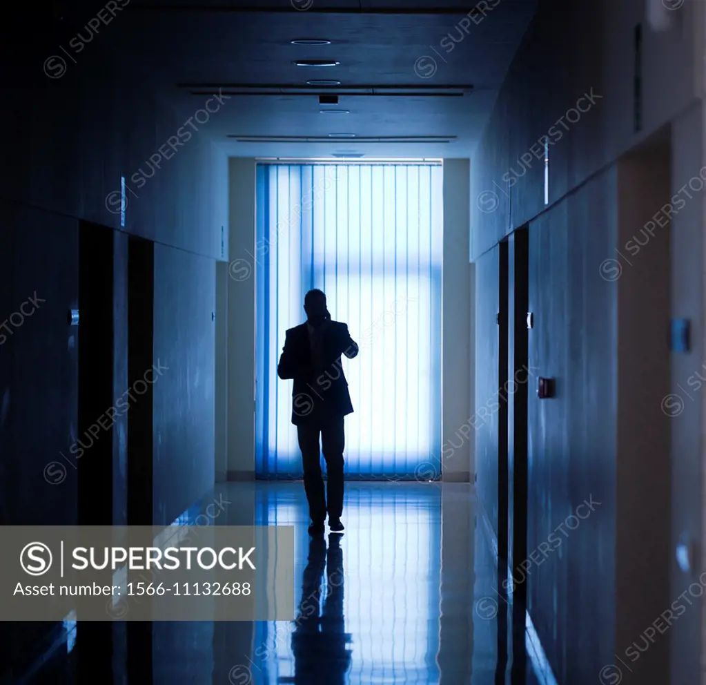 silhouette of a man in a corridor.