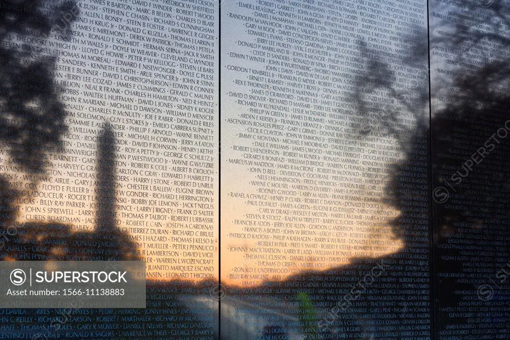 USA, Washington DC, Washington Monument reflected in the Vietnam War Memorial.