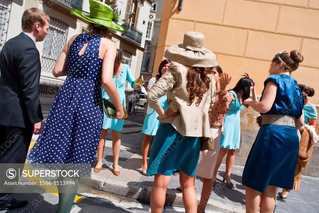 People dressed in an elegant way for a wedding in Malaga, Andalusia, Spain