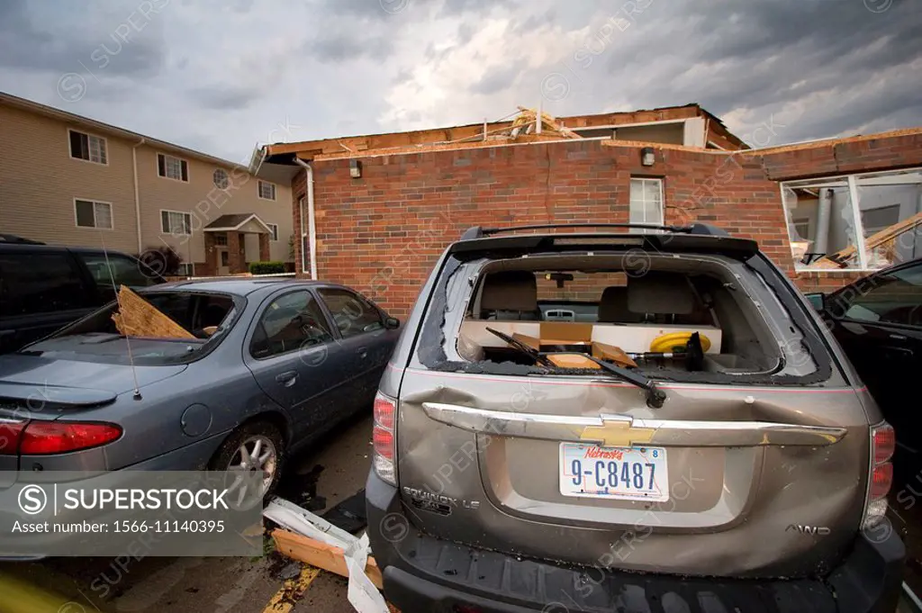 Damaged cars and a destroyed building at the Stratford apartment complex at 1919 West 39th after several tornadoes went through Kearney, Nebraska, May...