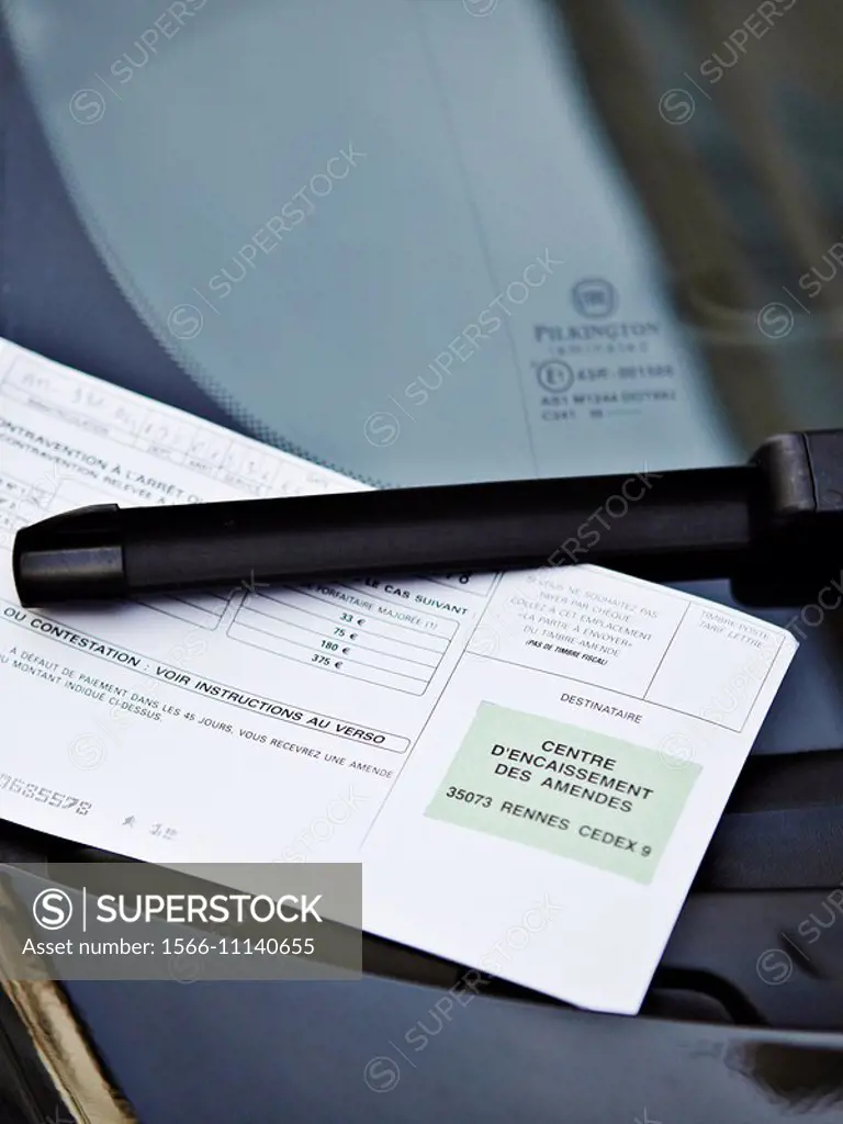 Ticket on the windshield of a car in Paris