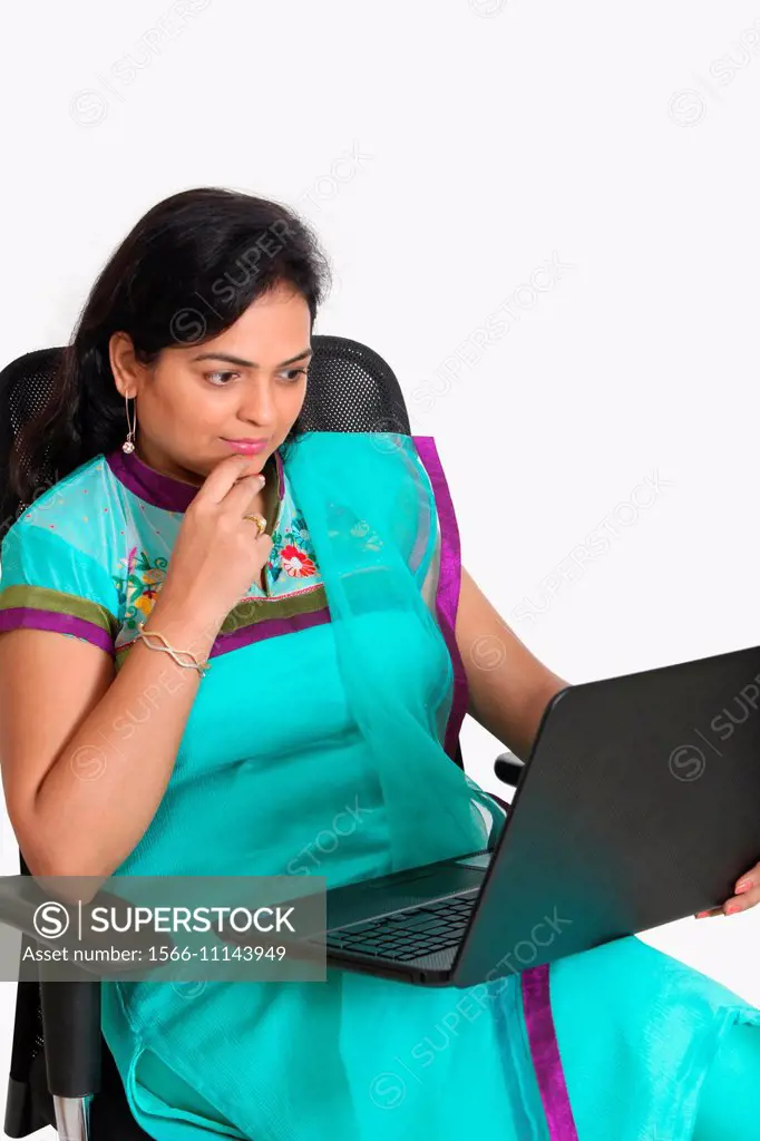 Lady working on a laptop, Pune, India.