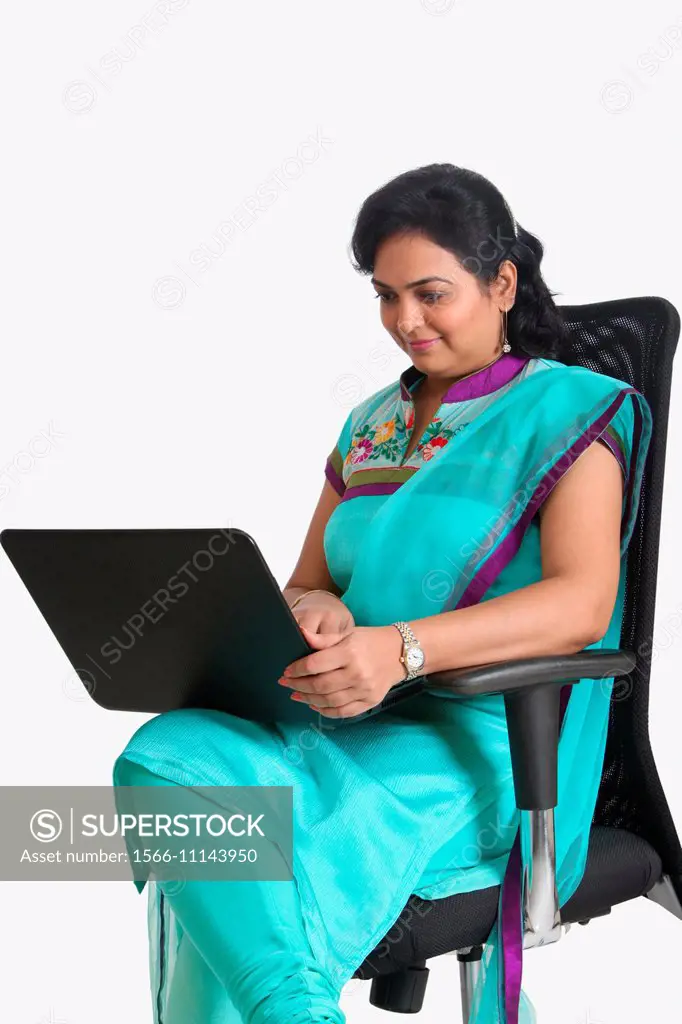 Lady working on a laptop, Pune, India.