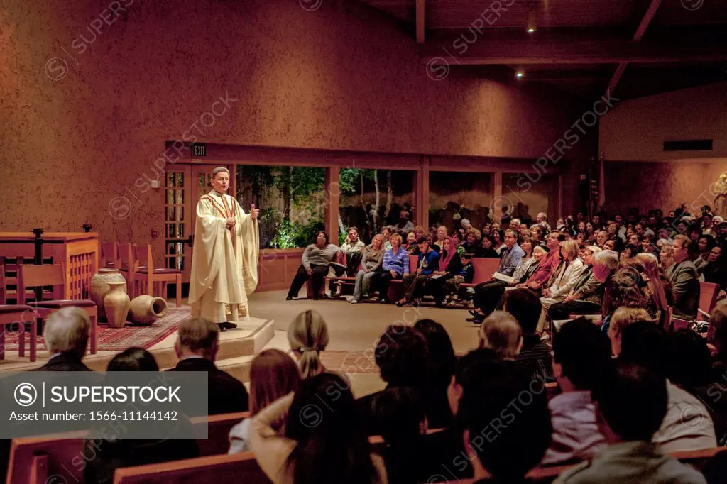 A pastor preaches a sermon to his congregation while conducting mass at St. Timothy´s Catholic Church, Laguna Niguel, CA.
