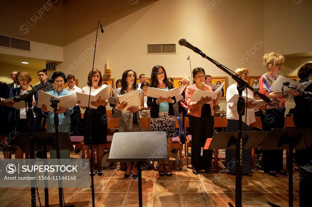 A multiracial choir sings during mass at St. Timothy´s Catholic Church, Laguna Niguel, CA.