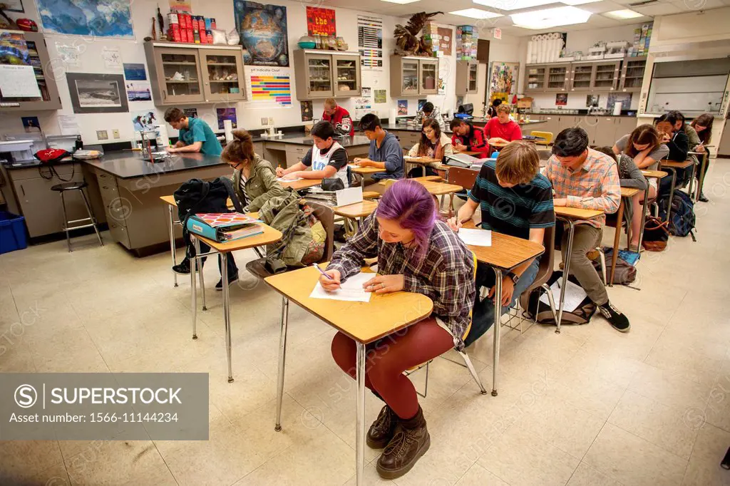 High school chemistry students take a classroom quiz in San Clemente, CA. Note purple hair dye.