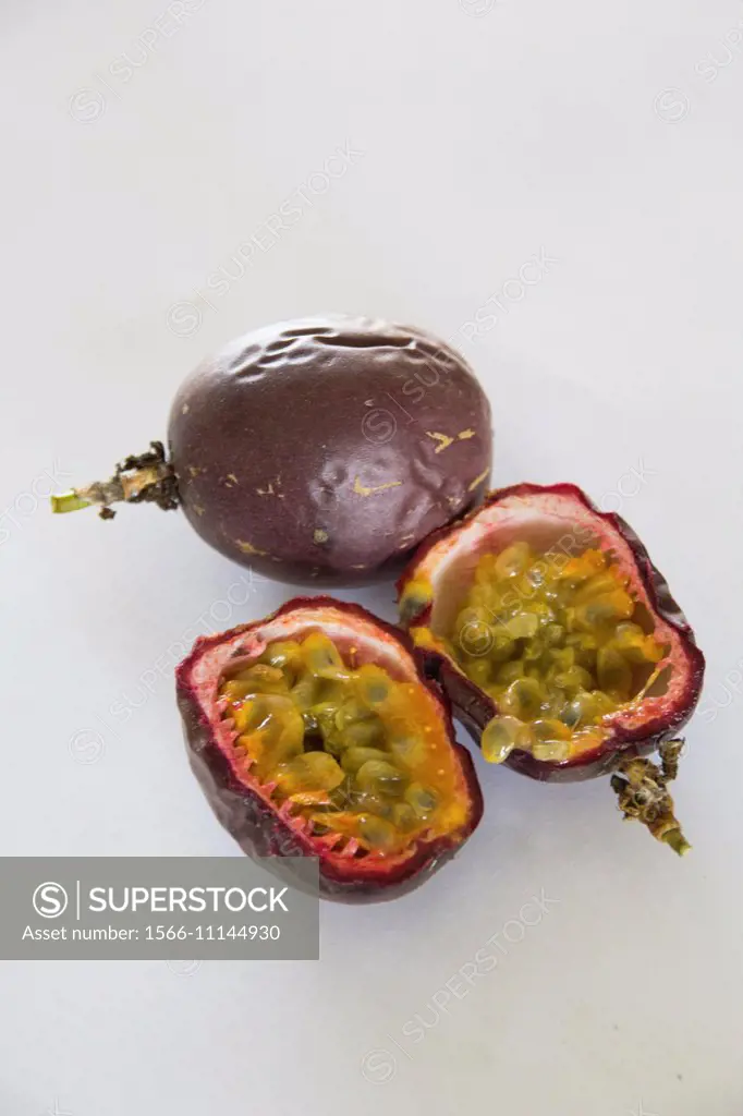 Passionfruit, one sliced open.