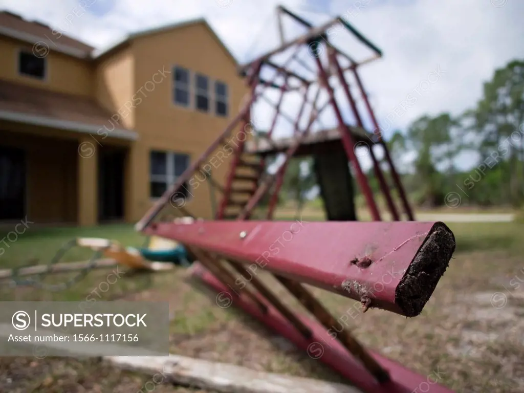 Broken playground in back yard of a foreclosed home in Port St  Lucie, Florida, Uniited States