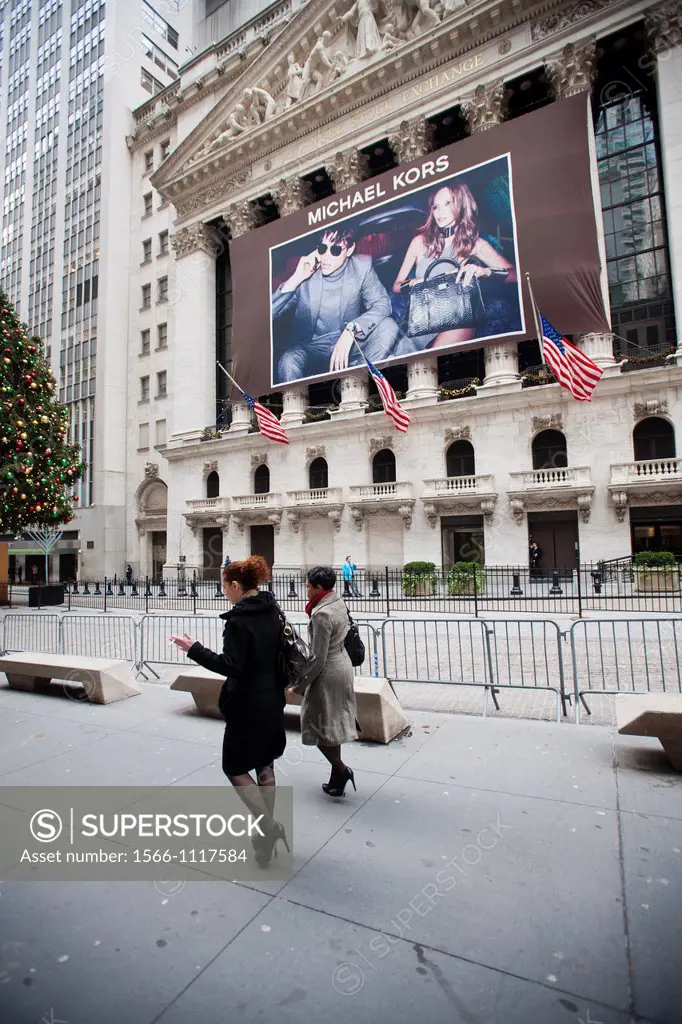 A banner for Michael Kors decorates the front of the New York Stock Exchange in New York Michael Kors Holdings Ltd launched its IPO today and raised $...