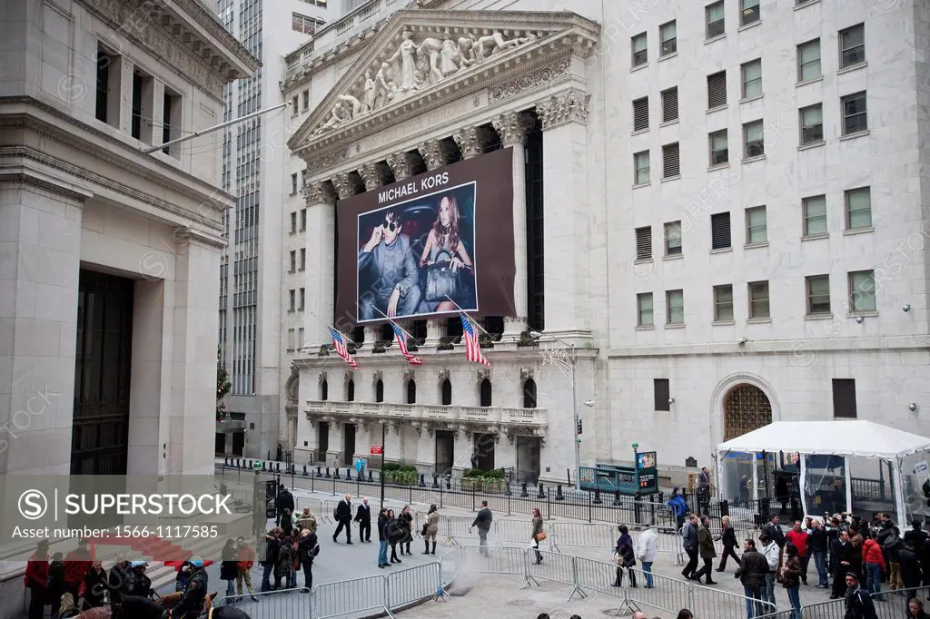 A banner for Michael Kors decorates the front of the New York Stock Exchange in New York Michael Kors Holdings Ltd launched its IPO today and raised $...