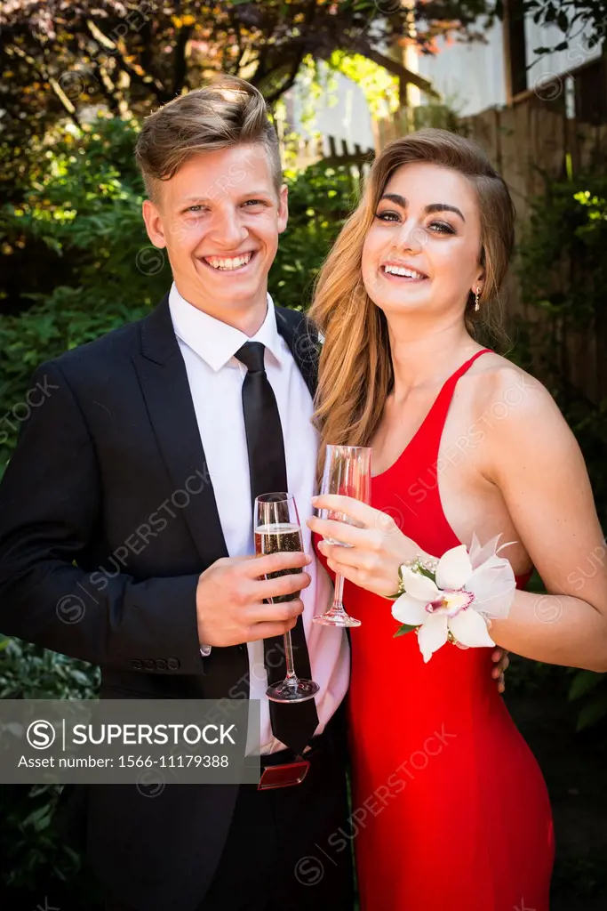a young couple, 18 years, celebrate with champagne.