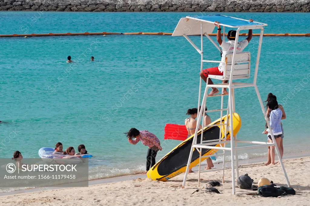 Ginowan, Okinawa, Japan: tourists at the beach in summertime