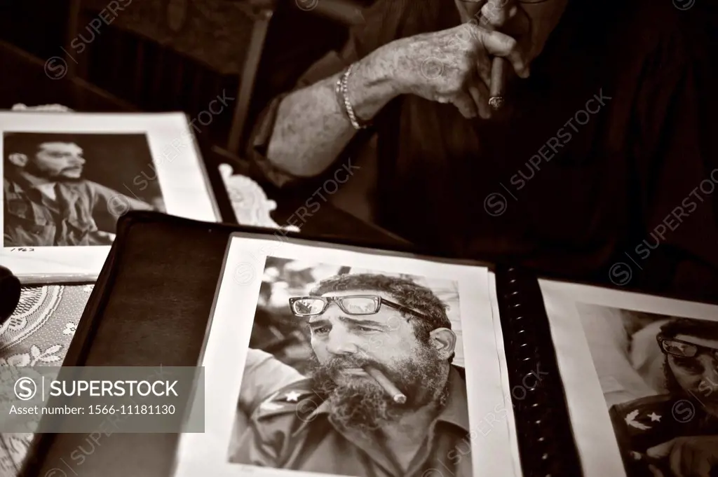 Cuban photographer Liborio Noval (1936-2012), holding a photograph of Fidel Castro smoking a cigar, was one of the most iconic photographers of the Cu...