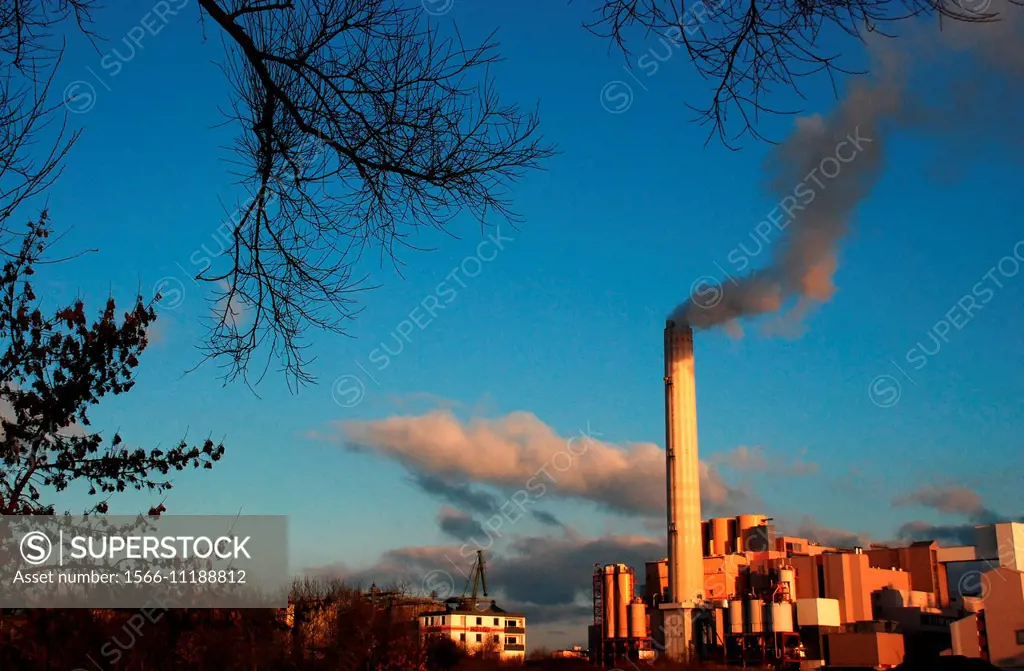 Smoke rises from the chimney of a factory in Germany