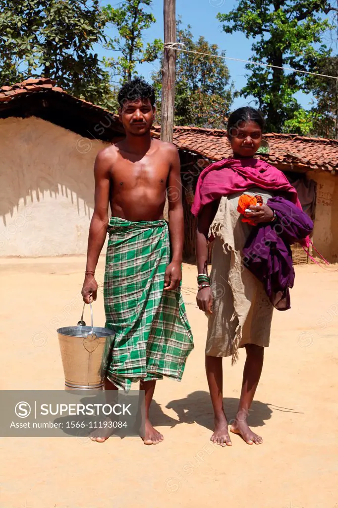 Tribal couple going for a bath, Birhor tribe. Chueya Village, Korba District, Chhattisgarh, India.