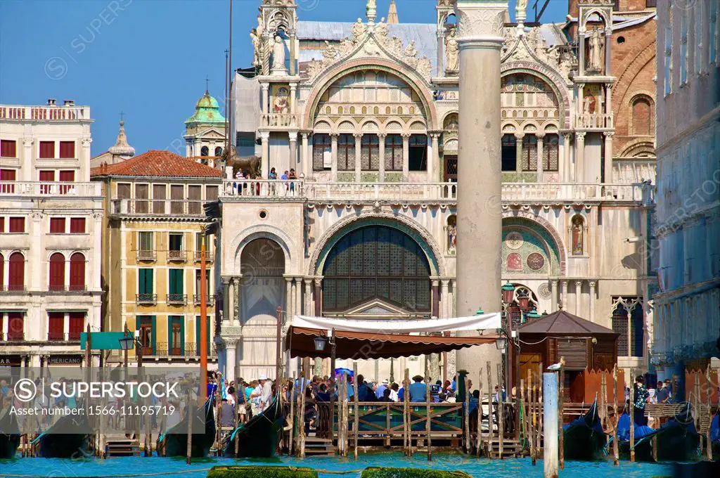 San marco Basilica, tourists and gondolas, San Marco, Venice, Italy.