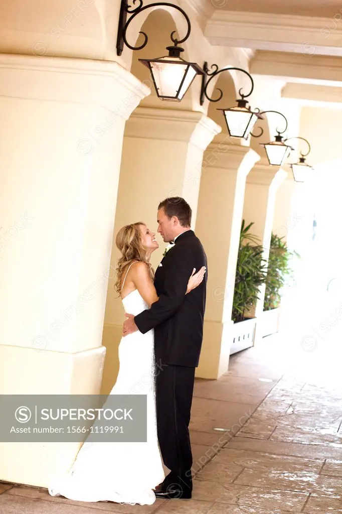 bride groom happy embrace wedding reception in wedding dress tux