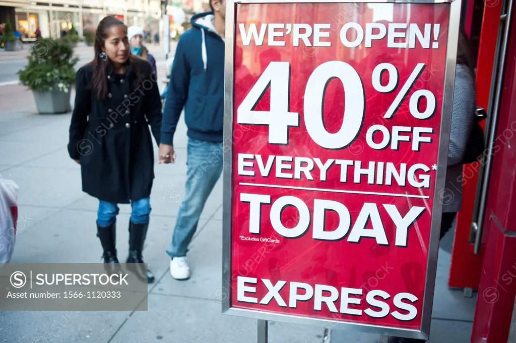 Shoppers enter the Express store in the Herald Square shopping district in New York looking for bargains on Thanksgiving Day Many retailers are openin...