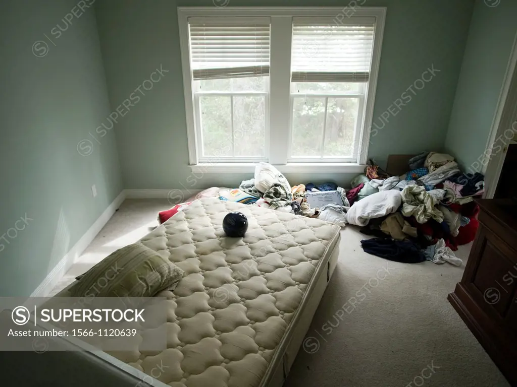 Disheveled bedroom of foreclosed home in Talahassee, Florida, United States