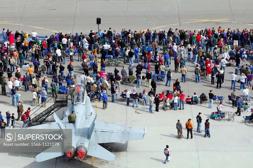 Overview of spectators and jet fighter F-18 Hornet on tarmac, Anchorage Arctic Thunder air show, Elmendorf Air Force base, Alaska USA