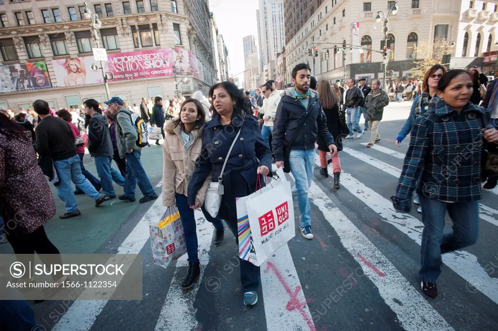 Shoppers in the Herald Square shopping district in New York looking for bargains on Black Friday, the day after Thanksgiving Many retailers opened the...