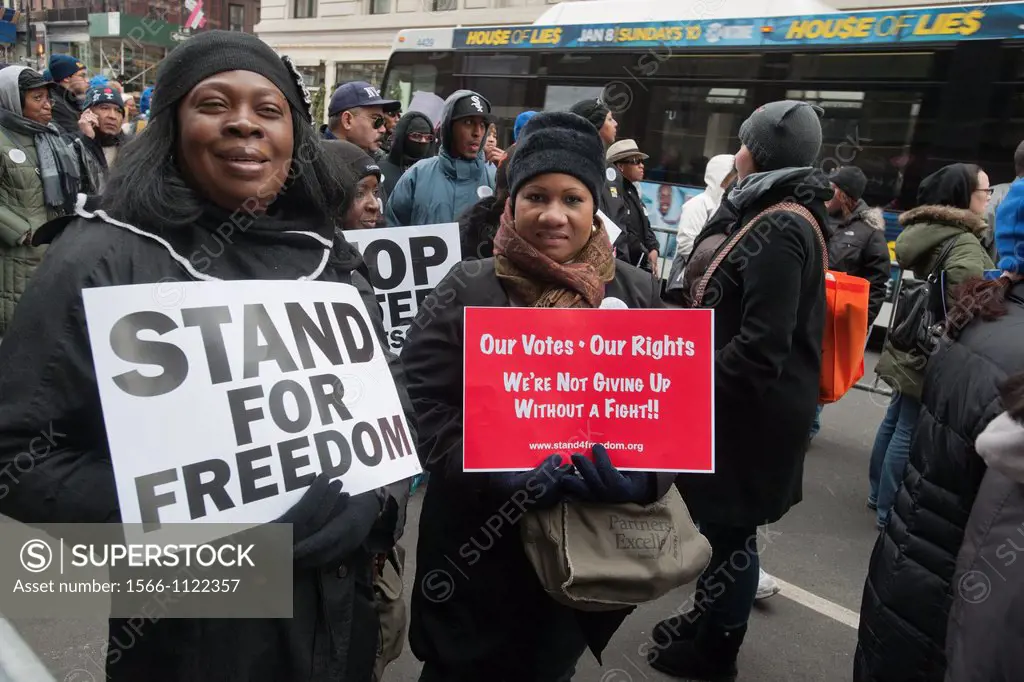 Activist members of the NAACP and unions march and rally, starting at the offices of Koch Industries, in New York on Human Rights Day, against the imp...