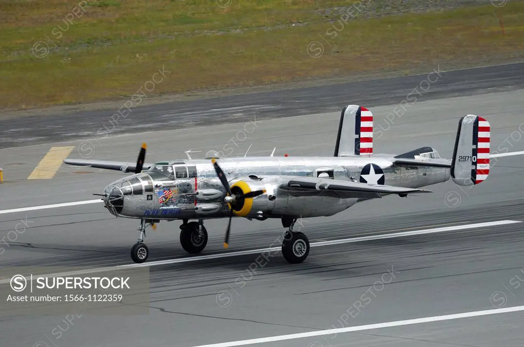 Old WWII bomber plane North American B-25 J Mitchell ´Pacific Prowler´ landing on runway during an air show, Anchorage, Alaska, Usa