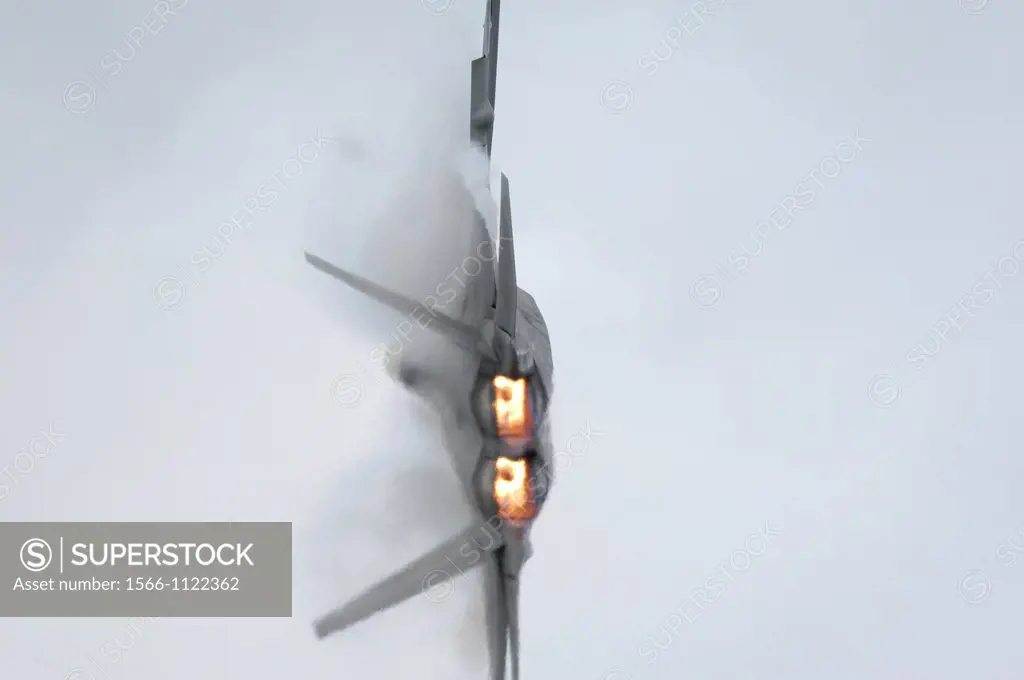 Modern and stealth american jet fighter F-22A Raptor turning  Note nozzles incorporate thrust vectoring new technology  Elmendorf air foece base, Anch...