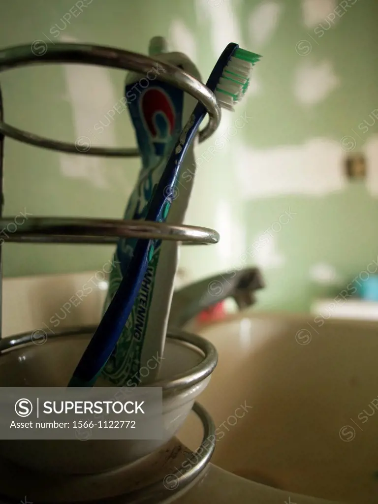 Toothbrush and toothpaste left inside the bathroom of a foreclosed house in Woonsocket, Rhode Island, United States