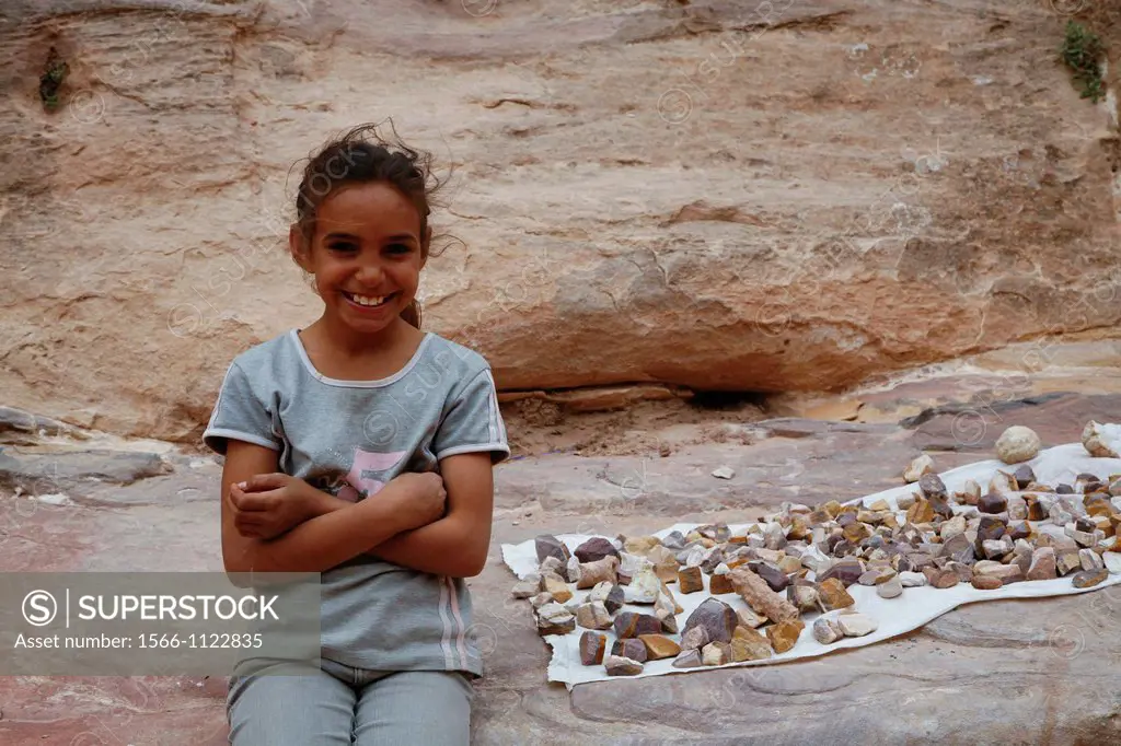 Portrait of a young beduin girl selling sandstone for tourists, Petra, Jordan