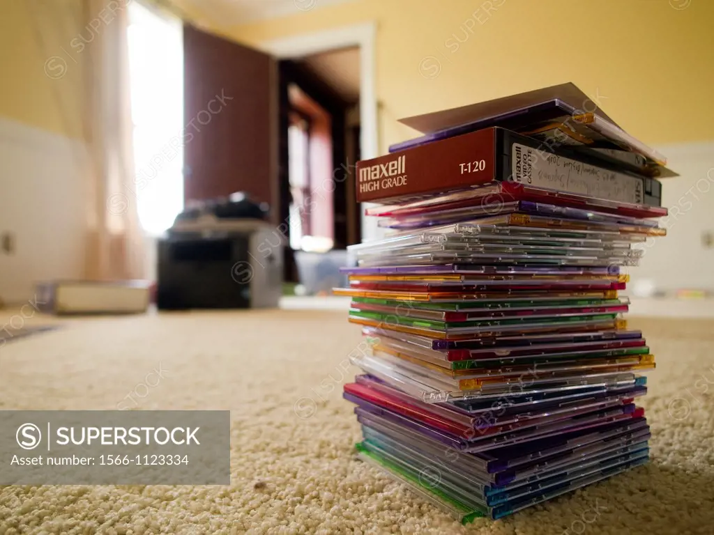 Stack of cds on floor in messy-room inside of a foreclosed home in Talahassee, Florida, United States
