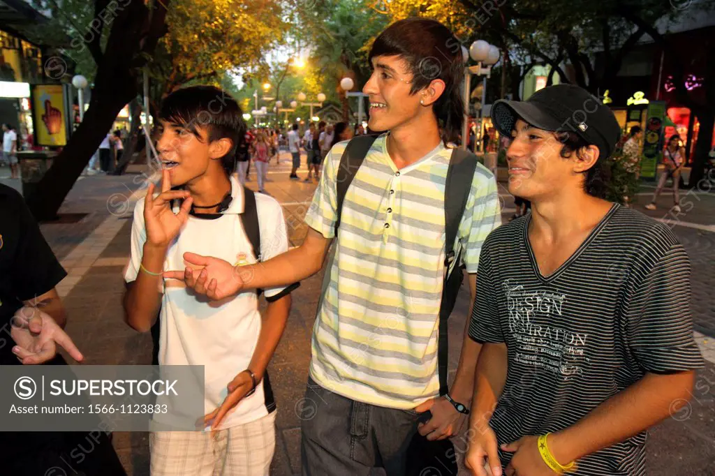 Argentina, Mendoza, Paseo Sarmiento, promenade, pedestrian mall, shopping, dining, Hispanic, boy, teen, adolescent, student, socialize, friends, laugh...