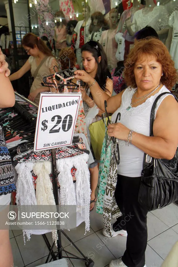Argentina, Mendoza, Avenida San Martin, Hispanic, shopping, store, business, clothing, sign, sale, discount, Spanish language, Hispanic, woman, browsi...
